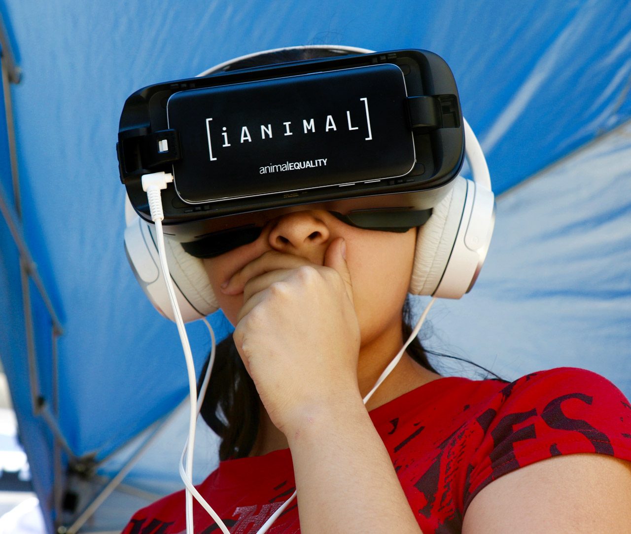 Woman watching iAnimal with a virtual reality headset