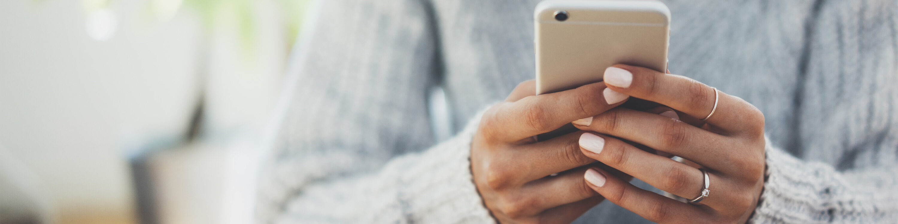 Hands holding a mobile phone