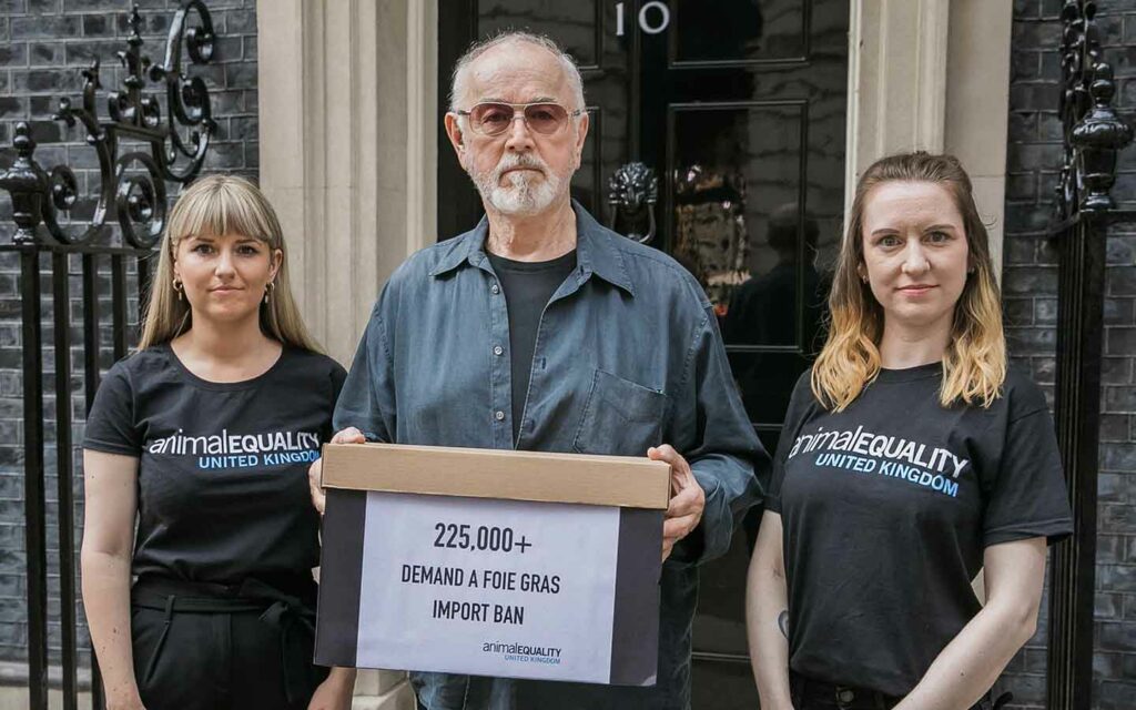Animal Equality with Peter Egan delivering over 225,000 signatures against foie gras