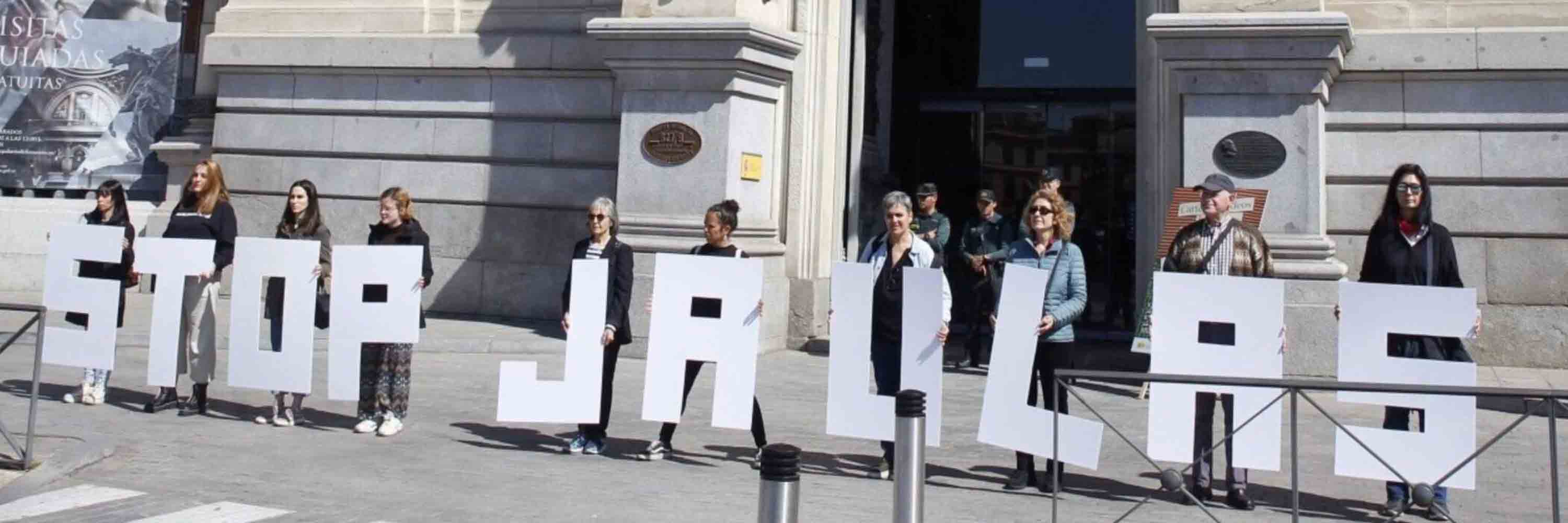 Animal Equality with fellow activists holding signs that say Stop Jaulas