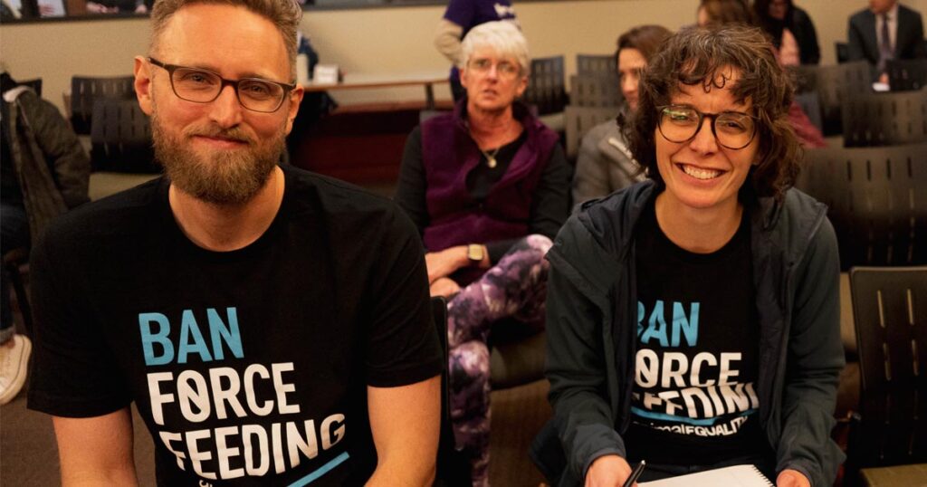 Animal Equality volunteers showing their support for a ban on force feeding.