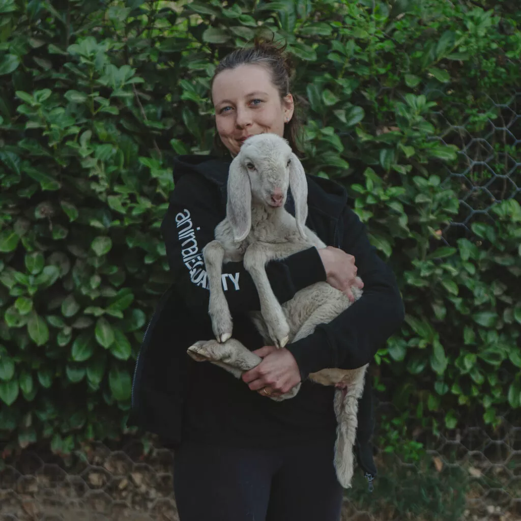 Woman holding a lamb