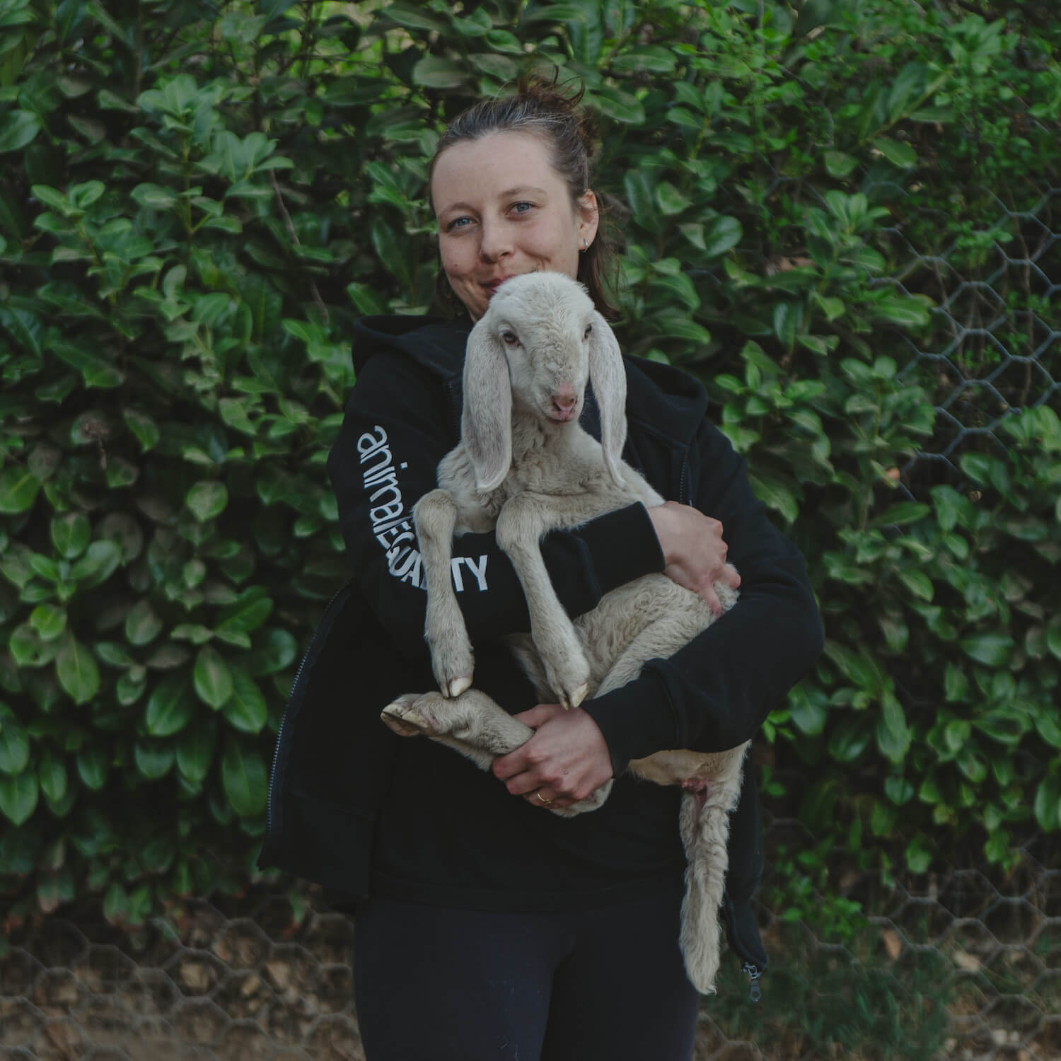 Woman holding a lamb