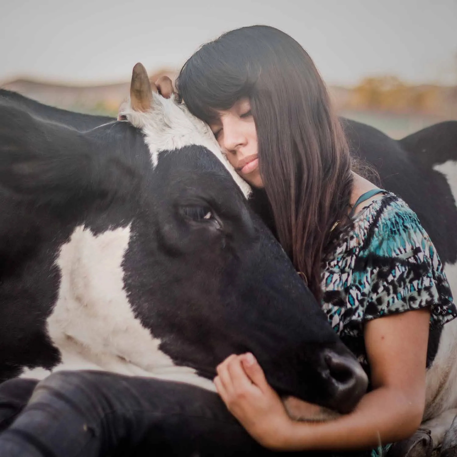 Woman and rescued cow