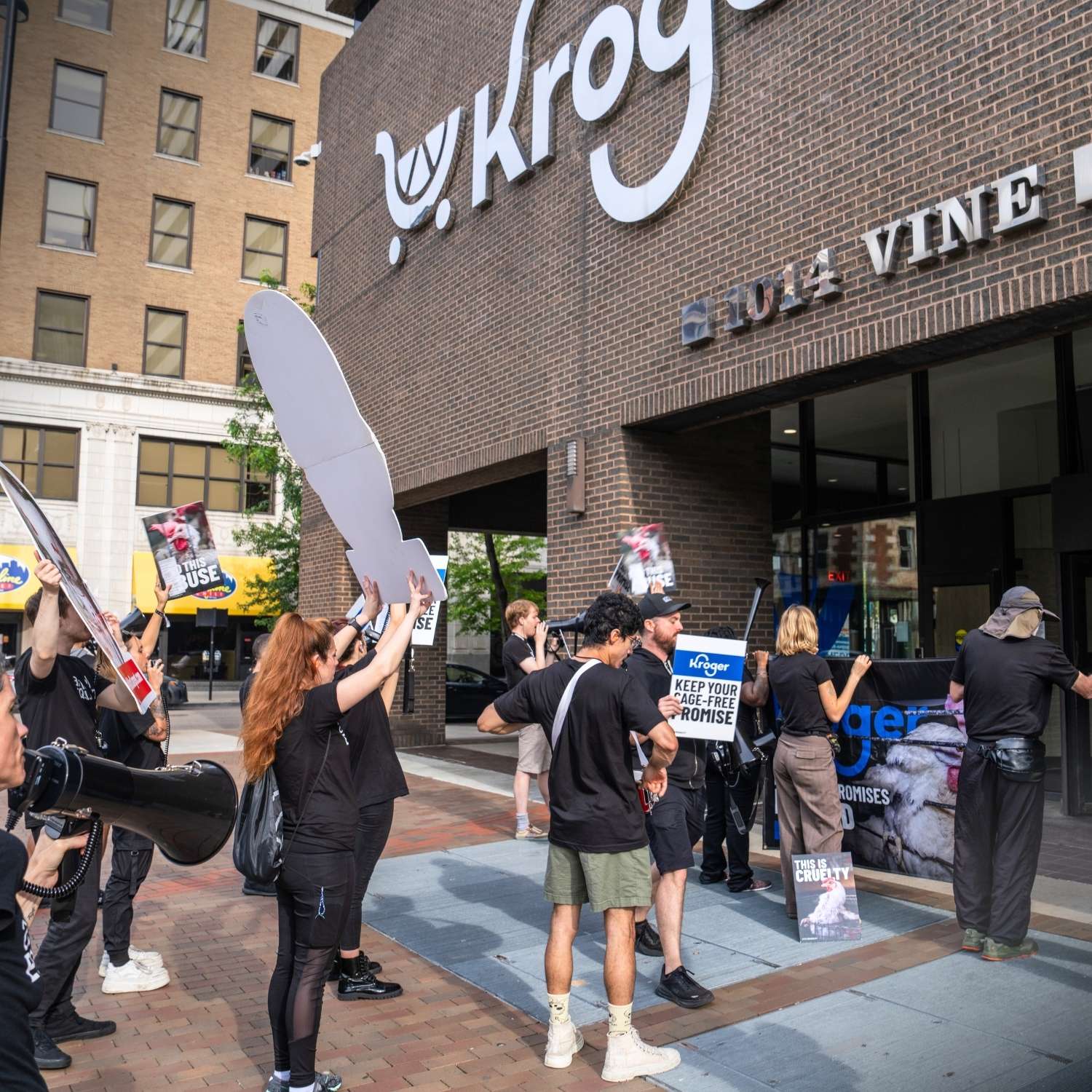 Animal Equality activists protest outside Kroger's Cincinnati headquarters on May 26, 2026.