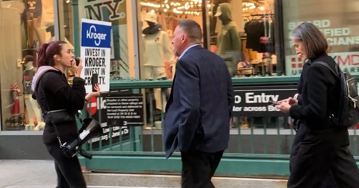 Animal Equality activist confronts Kroger board member Nora Aufreiter on the streets of New York City outside the New York Stock Exchange on October 20, 2026.